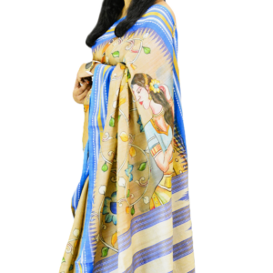 Hand-painted beige and blue saree featuring an intricate artwork of a traditional Indian woman, adorned with floral motifs and fine detailing