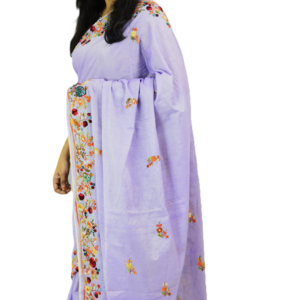 Elegant lavender saree with intricate floral embroidery, delicately draped by a woman, showcasing timeless craftsmanship and graceful charm.
