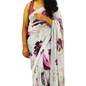 Elegant white saree with soft pink and maroon floral prints, draped gracefully by a woman, exuding sophistication and charm