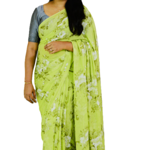 Light green floral print saree with delicate white blossoms, draped elegantly by a woman, showcasing effortless charm and sophistication